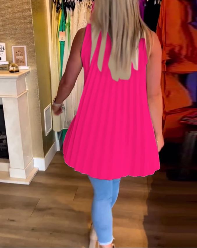 Sleeveless top with ruffles and cuffs