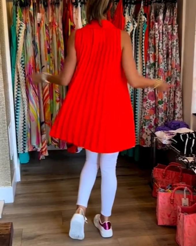 Sleeveless top with ruffles and cuffs