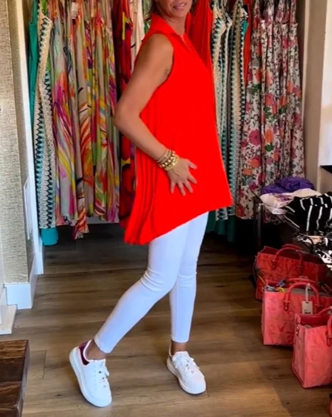 Sleeveless top with ruffles and cuffs