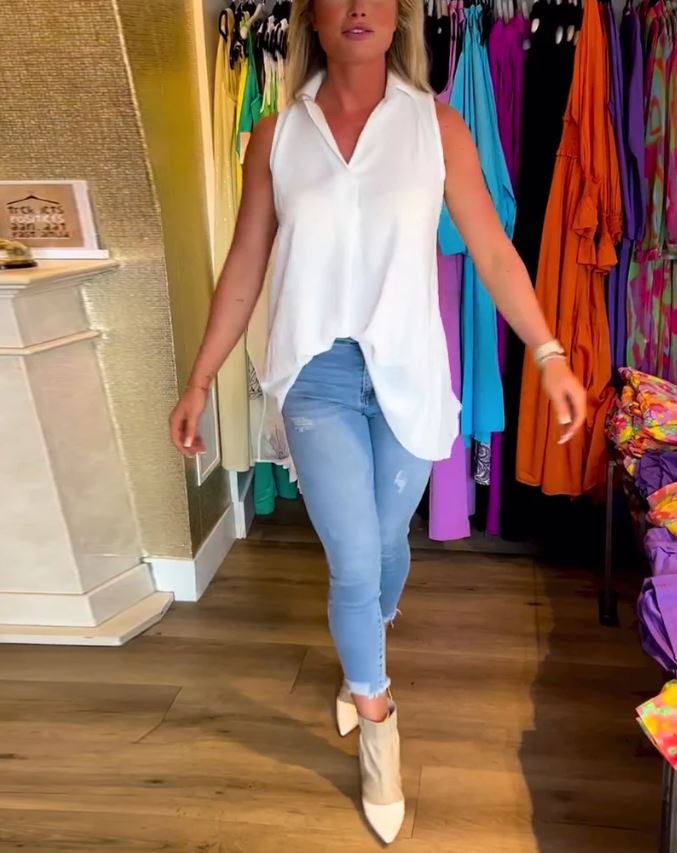 Sleeveless top with ruffles and cuffs