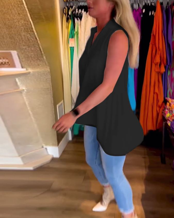 Sleeveless top with ruffles and cuffs