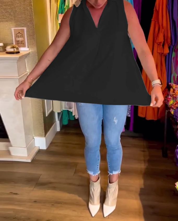 Sleeveless top with ruffles and cuffs