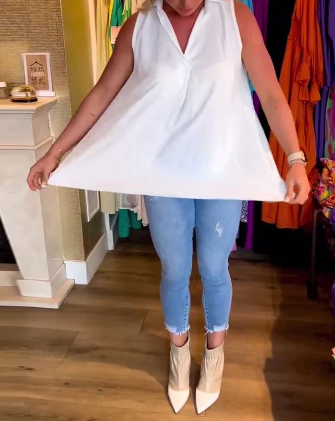 Sleeveless top with ruffles and cuffs