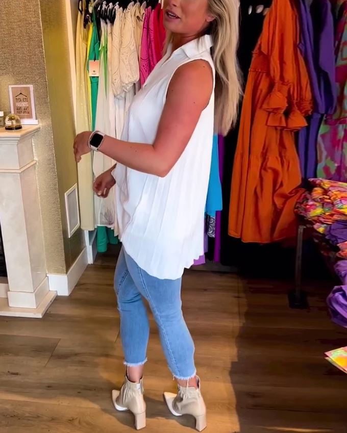 Sleeveless top with ruffles and cuffs